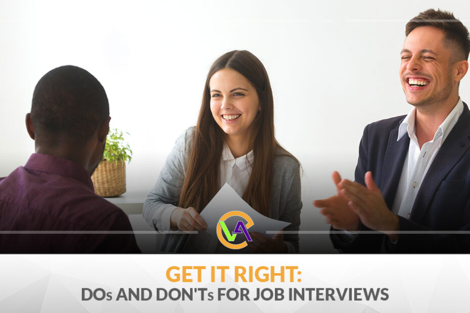 person applauding and interviewee, with a woman beside him smiling and with a look of approval